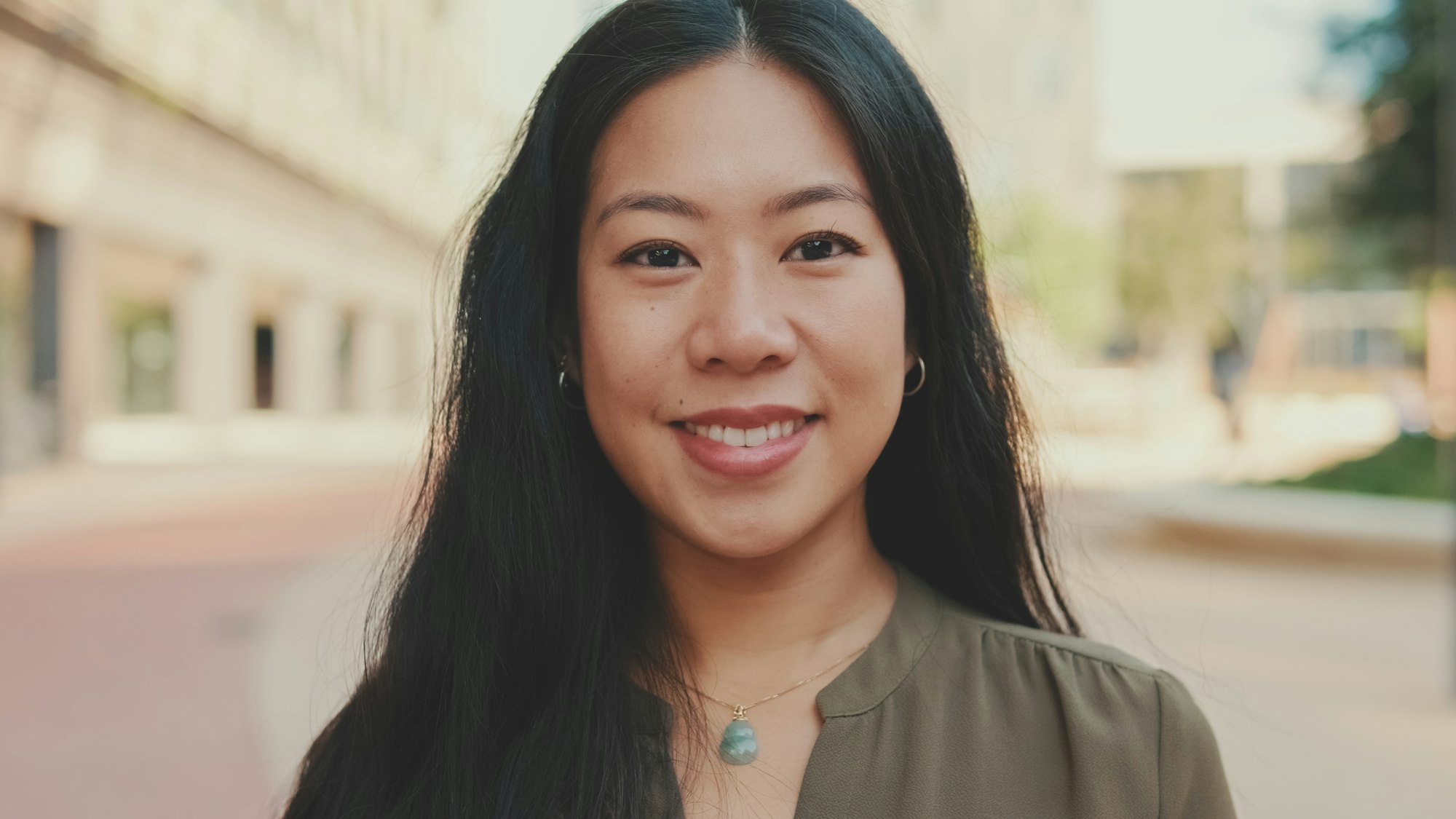 Close-up of young woman looking at the camera and smiling