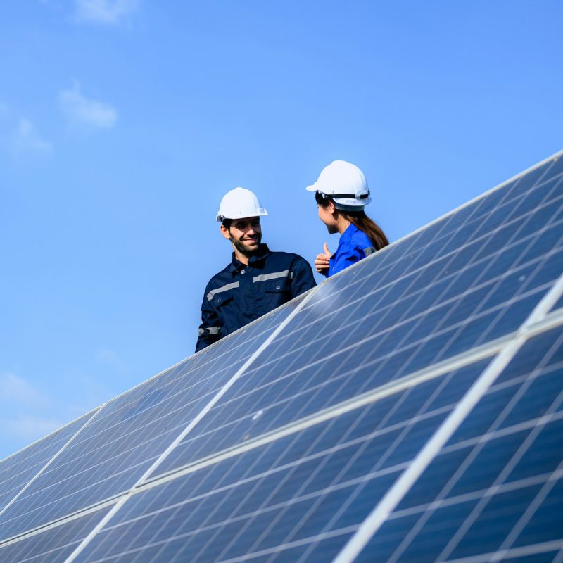 Solar panel station, Engineer installing solar panel at solar energy farm field