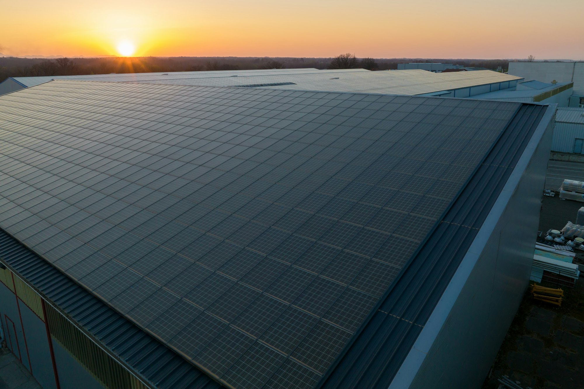 Blue photovoltaic solar panels mounted on building roof