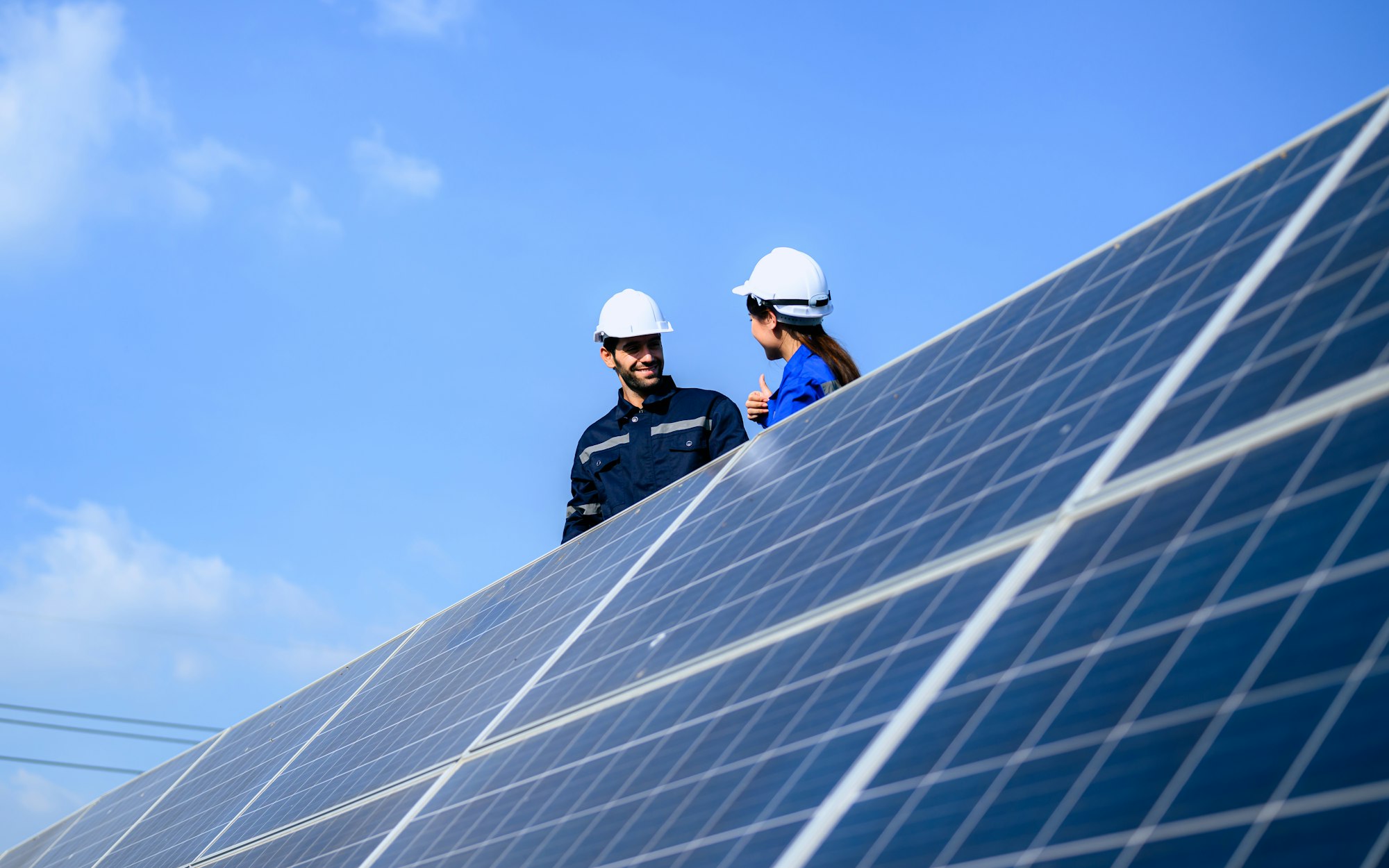 Solar panel station, Engineer installing solar panel at solar energy farm field