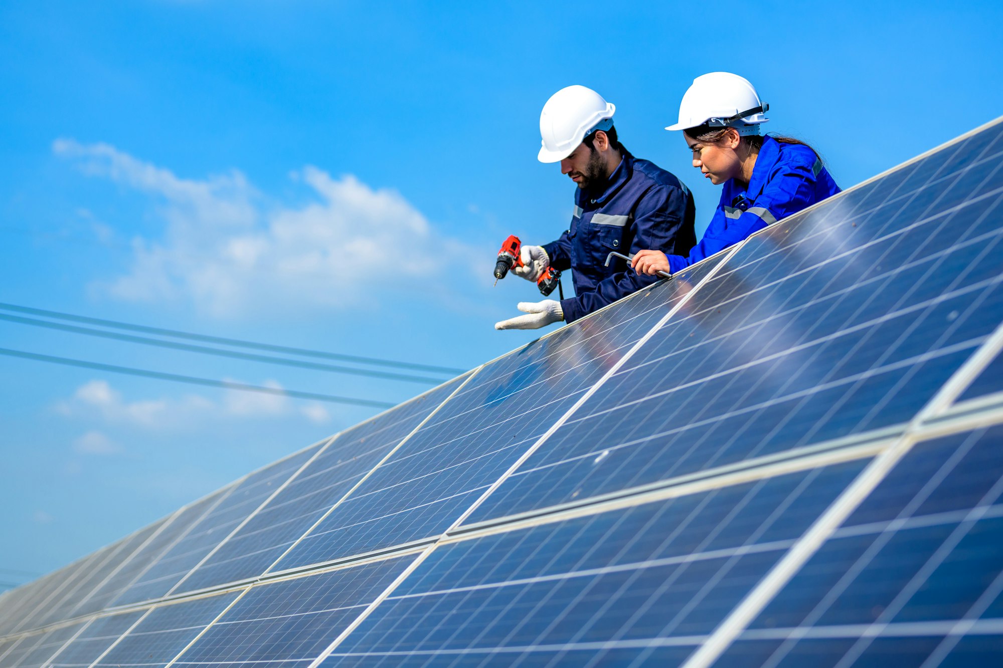 Solar panel station, Engineer installing solar panel at solar energy farm field